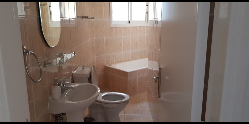 A resale 3 bedroom apartment with a communal pool in the tourist area of Paphos — photo 8